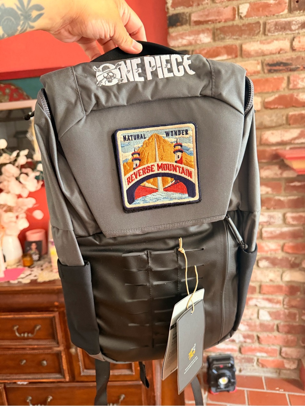Exclusive Onepiece Gray & Black backpack post production wrap gift.